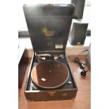 An early 20th Century wind up portable gramophone in stained wood case