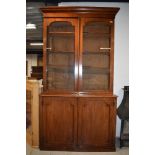 A Victorian mahogany bookcase having double cupboard under, dimensions approx. W122cm H228cm