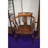 An early 20th Century stained frame elbow chair