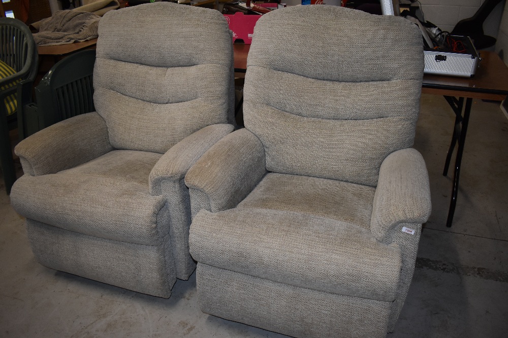 Two modern manual recliner armchairs, in cream