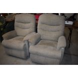 Two modern manual recliner armchairs, in cream