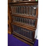 Am early 20th Century oak three tier stacking bookcase in the Globe Wernicke style having stepped
