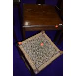 A vintage squarre occasional castered table and a strung stool