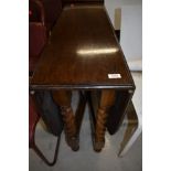An early to mid 20th Century oak twist gate leg table of narrow proportions, approx 91 x 32cm closed