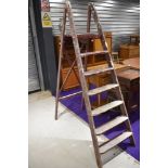 A set of vintage wooden decorators ladders