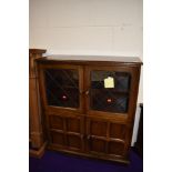 A vintage part oak bookcase with double cupboard under, width approx. 92cm, depth 32cm