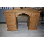 A stripped pine desk, approx. Dimensions width 122cm, depth 50cm height 76cm