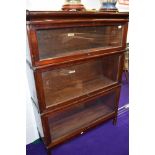 An early 20th Century stained frame stacking bookcase, three tiers, labelled Globe Wernicke