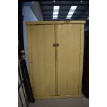 A vintage painted pine cupboard, having shelved interior, approx. dimensions W125cm H168cm D40cm