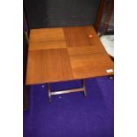 A vintage folding occasional side table