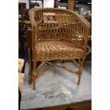 A small wicker work chair, child or dolls size, width approx. 33cm