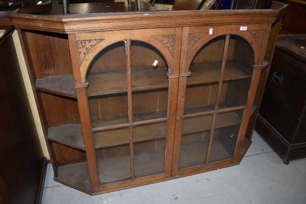 A stripped part glazed dresser back with canted shelf section