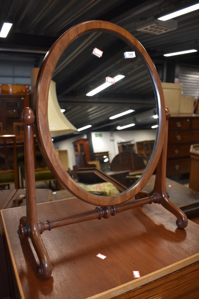 A Victorian mahogany toilet mirror, on turned frame, width approx. 58cm