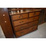 A 19th Century oak chest of two over three drawers, having later, but still period, brass drop