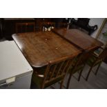A nice quality reproduction Regency extending dining table, and a set of six (four +two)