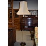 A vintage brass standard lamp