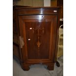 An Edwardian mahogany and inlaid corner cupboard, on bracket feet, height approx. 102cm