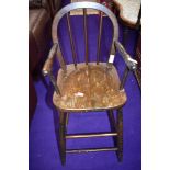 A traditional stained frame high chair