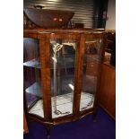 A mid 20th Century dark walnut bow fronted display cabinet, width approx. 104cm