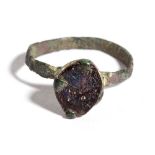 Reinassance Bronze Ring with Violet Glass, 15th - 16th century; diam cm 1,8. Provenance: English