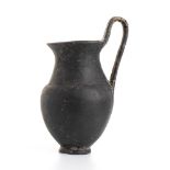 Etruscan Bucchero Olpe, 7th - 6th century BC; height cm 18, diam. cm 7,8; Restored. Provenance: