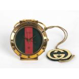 GUCCI TRAVEL WATCH 90s A Gucci 0300 travel watch, quartz movement, gold plated steel, green and
