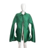 EKTOR ROMA CAPE 70s A green shantung cape, Bust 85 cm. General Conditions grading B/C (signs of