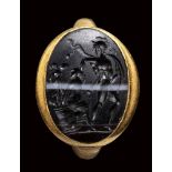 A roman banded agate intaglio set in a gold ring. Ajax with Cassandra.