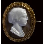 A neoclassical two-layers agate cameo mounted on a gold brooch. Sapho.