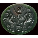 A roman green jasper astrological intaglio. Helios with solar quadriga.