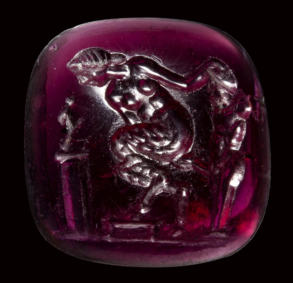 A fine late hellenistic garnet intaglio. Erotic scene with herm.