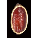 A roman carnelian intaglio set ina modern gold ring. Homoerotic "paiderastia" scene.