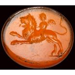 A roman carnelian intaglio. Eros on a lion.