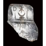 A late roman rock crystal fragment of a bulla. Constantinian inscriptions with emblema.
