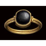 A late roman gold ring set with an onyx stone.