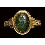 An early Victorian gold ring, set with a roman intaglio in chromian chalcedony. Bonus Eventus.