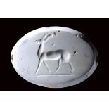 A large eastern greek burnt chalcedony seal intaglio. Deer.