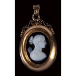 A neoclassical two-layers agate cameo mounted on a gold pendant. Bust of Psyche. Signed Girometti.