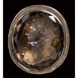 A quartz fumé intaglio set in a metal seal mounting. Portrait of Isaac Newton.