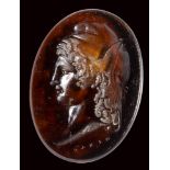 A neoclassical orange glass impression. Bust of Paris.