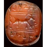 A semitic (paleo-hebrew) carnelian scaraboid stamp-seal. Deer and inscriptions.