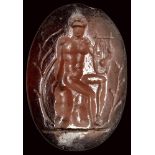 A roman late republican garnet intaglio. Apollo citharedus.