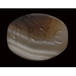 A graeco-roman agate engraved seal. Ear of corn and inscriptions.