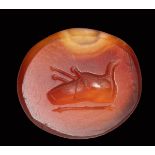 A roman republican carnelian intaglio. Shoe of a haruspex.