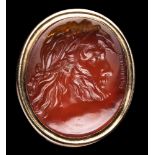 A fine carnelian intaglio seal engraved by Edward Burch. Zeus wearing a laurel wreath.