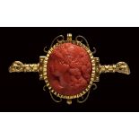 A fine Victorian coral cameo set in a gold brooch. Bacchante.