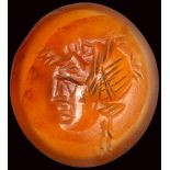 A roman late republian agate intaglio. Actor with mask.