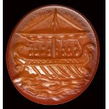 A roman carnelian intaglio. Galley with figures.