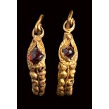 A roman pair of gold earring with garnets.
