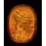 A very fine late hellenistic carnelian intaglio. Bust of Bacchante.